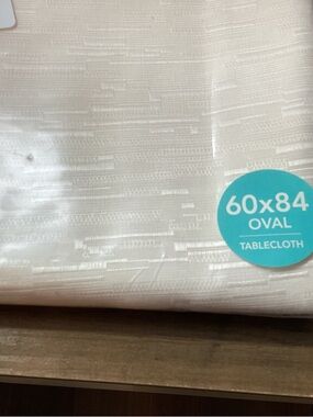 Elegant Oval Cream Tablecloth with Subtle Texture